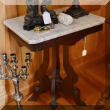 F109. Marble top Eastlake side table.